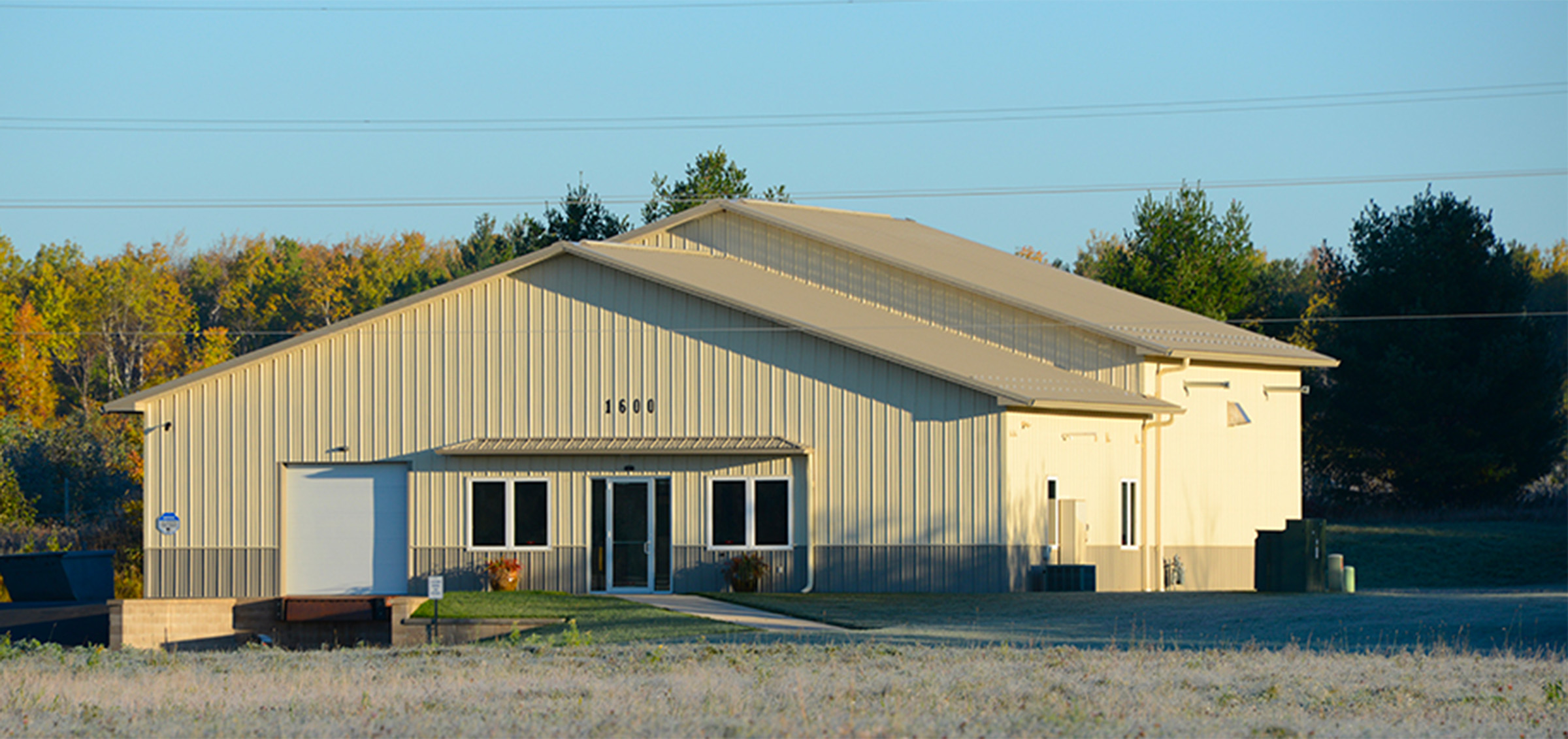 two-toned cream-colored post frame commercial building